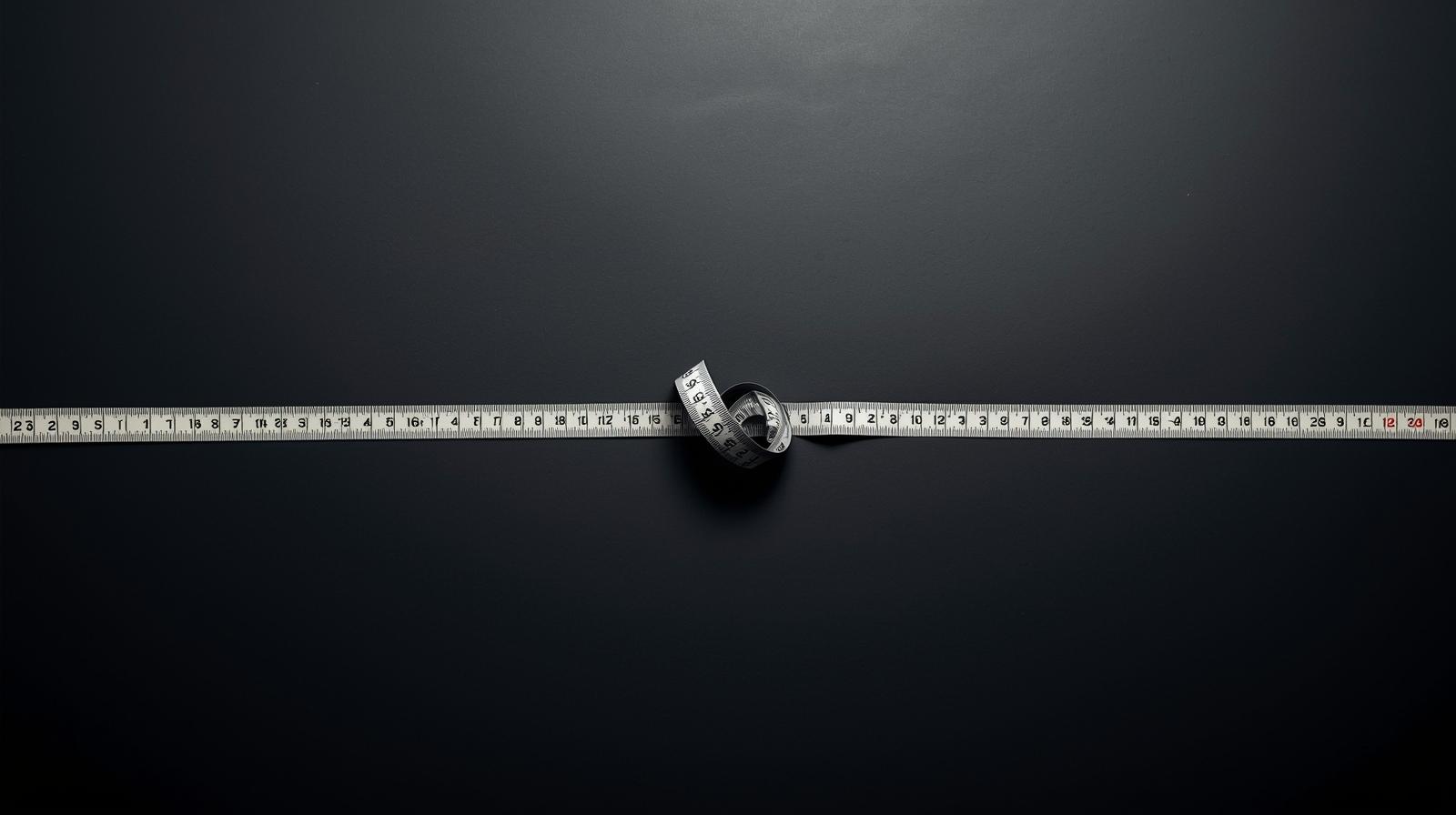 Twisted measuring tape representing the illusion of control and fragile progress in Ozempic and GLP-1 weight loss approaches